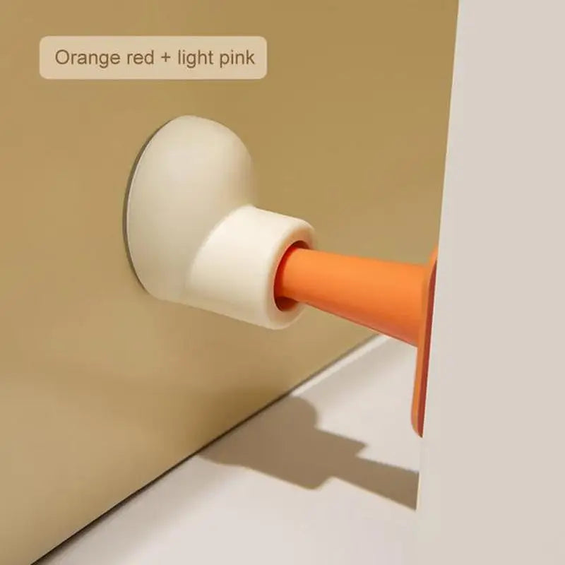 a close up of a white and orange door handle