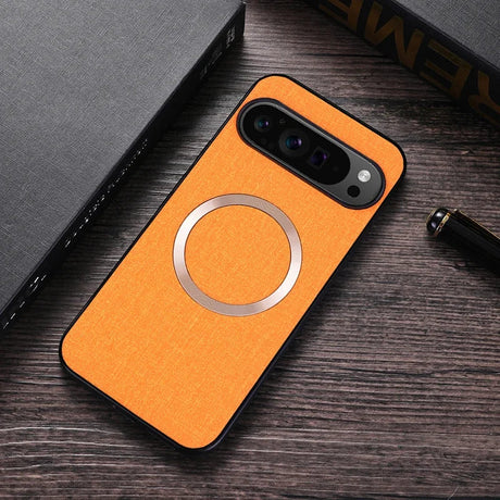 Orange smartphone case with a circular metallic accent and camera cutout.