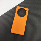 Orange smartphone case with a circular camera cutout.