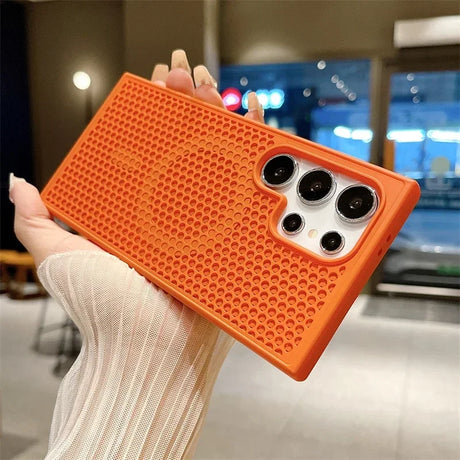 Orange textured phone case with multiple camera cutouts.