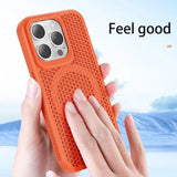 Orange textured phone case with a camera cutout being held by a hand.