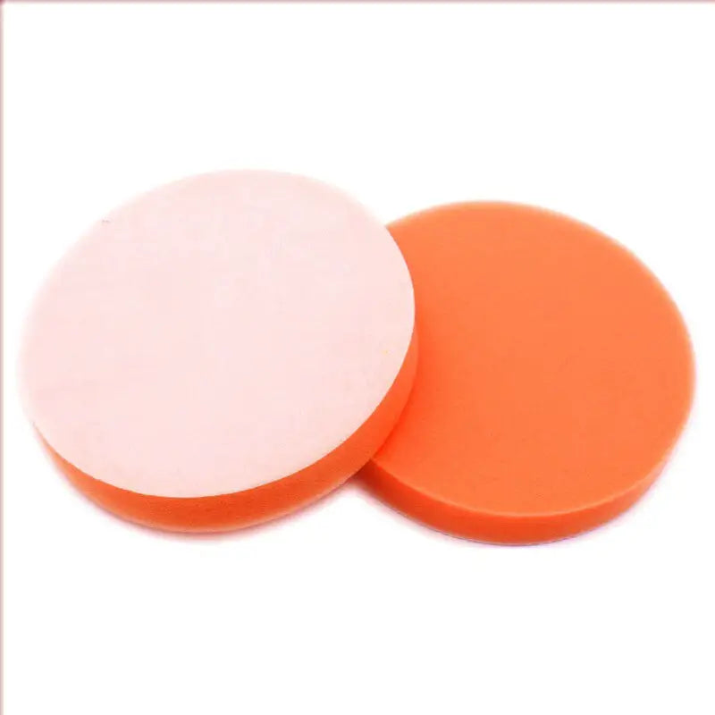 two orange and white round plastic discs