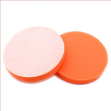 two orange and white round plastic discs