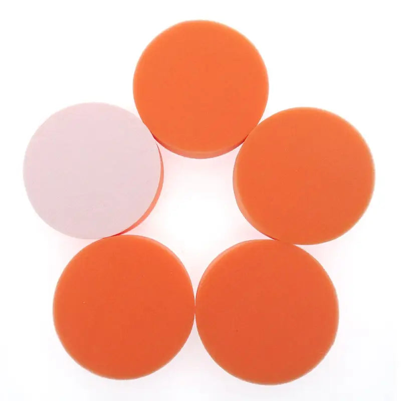 orange and white round foam coasters