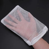 a hand holding a mesh bag with a white handle