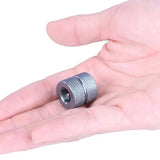 a hand holding a metal nut