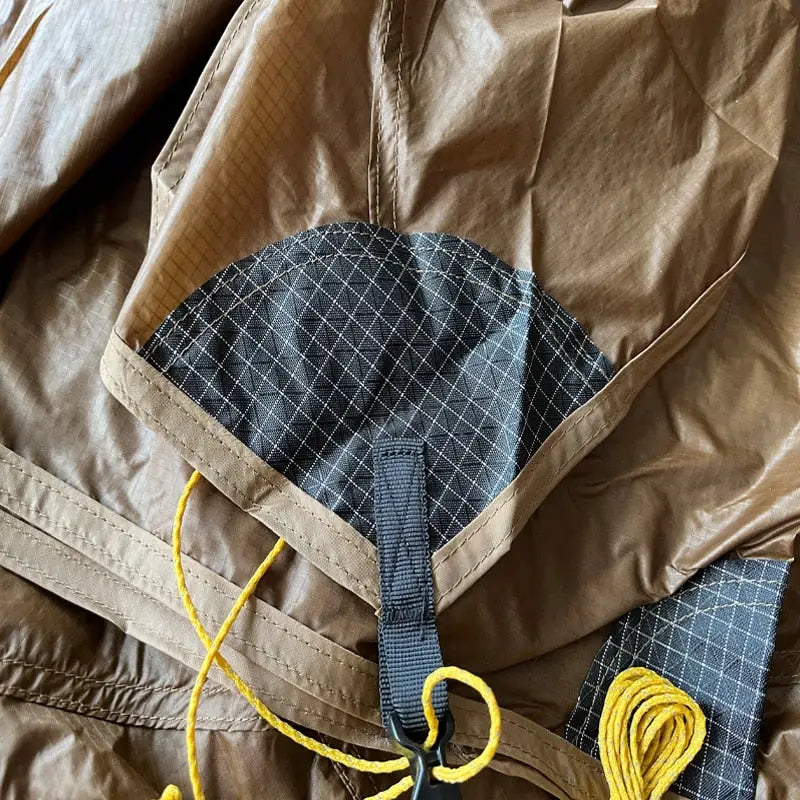 the back of a jacket with a yellow tie