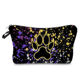 a black and gold dog paw print cosmetic bag