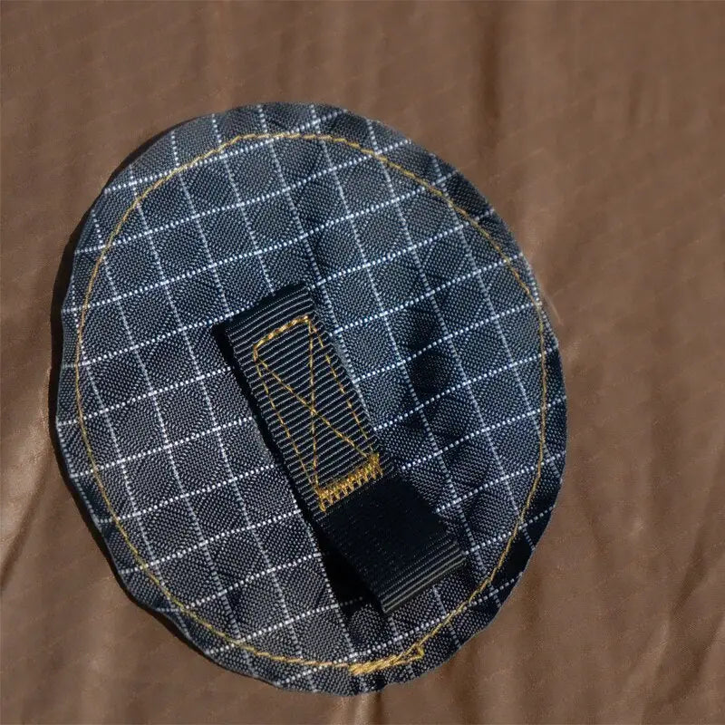 a black and white plaid pattern on a brown background