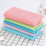 three colors of kitchen towels on a white counter