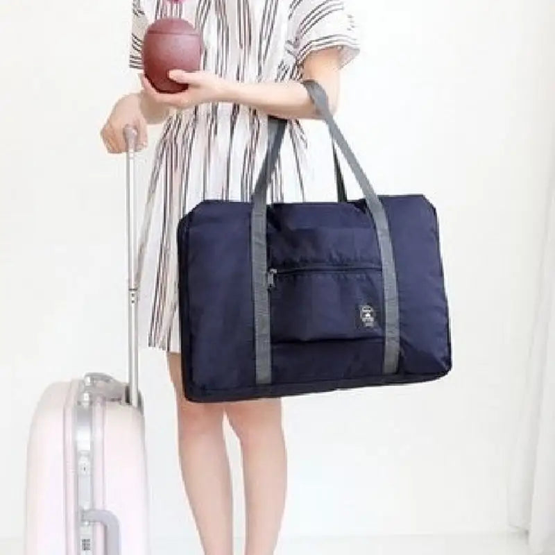 a woman holding a bag and a football