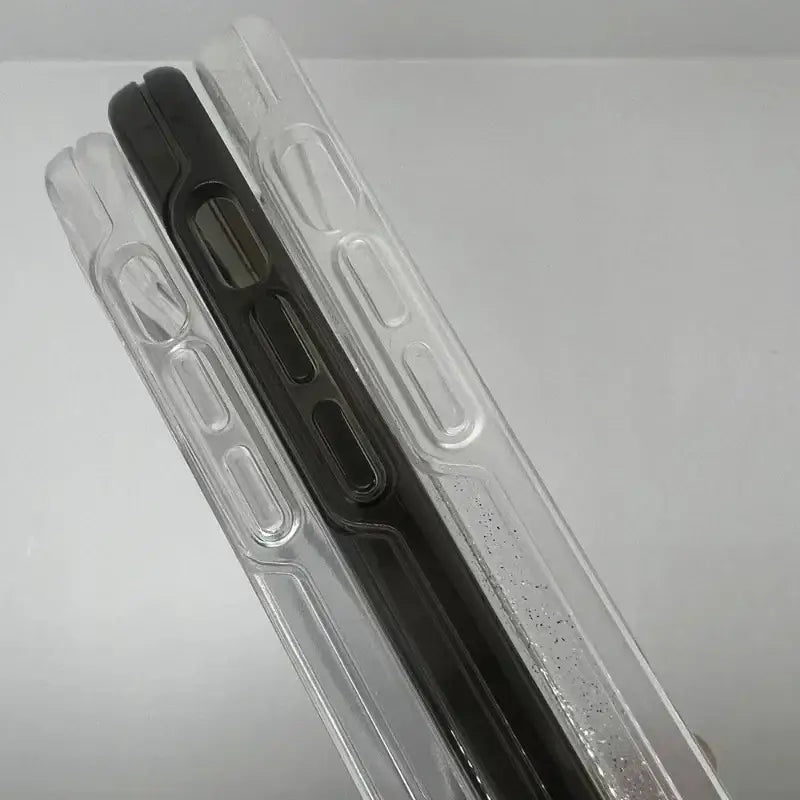 Packaging of a black pen in a clear box on a white surface