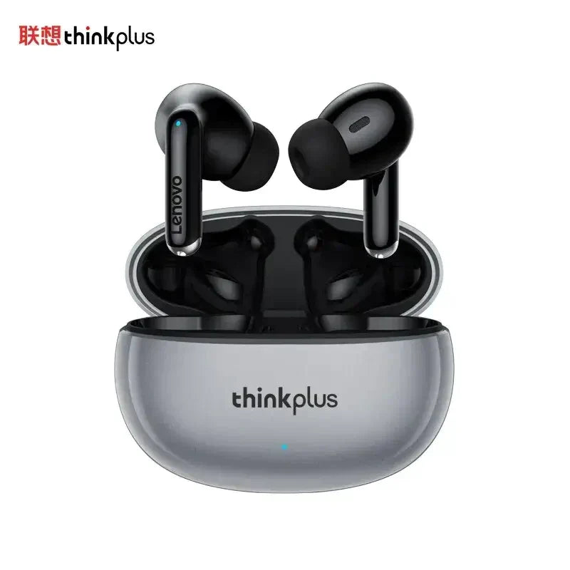 a pair of black earphones sitting on top of a silver box