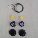 a pair of black earphones with yellow ear wires