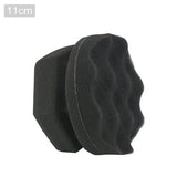 a black foam sponge on a white background