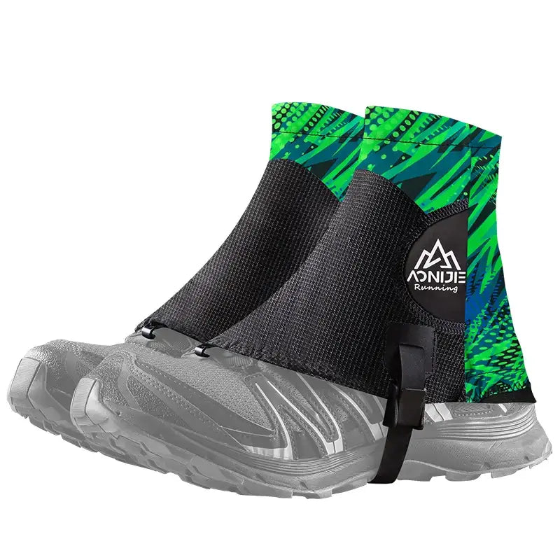 a pair of black and green snow boots