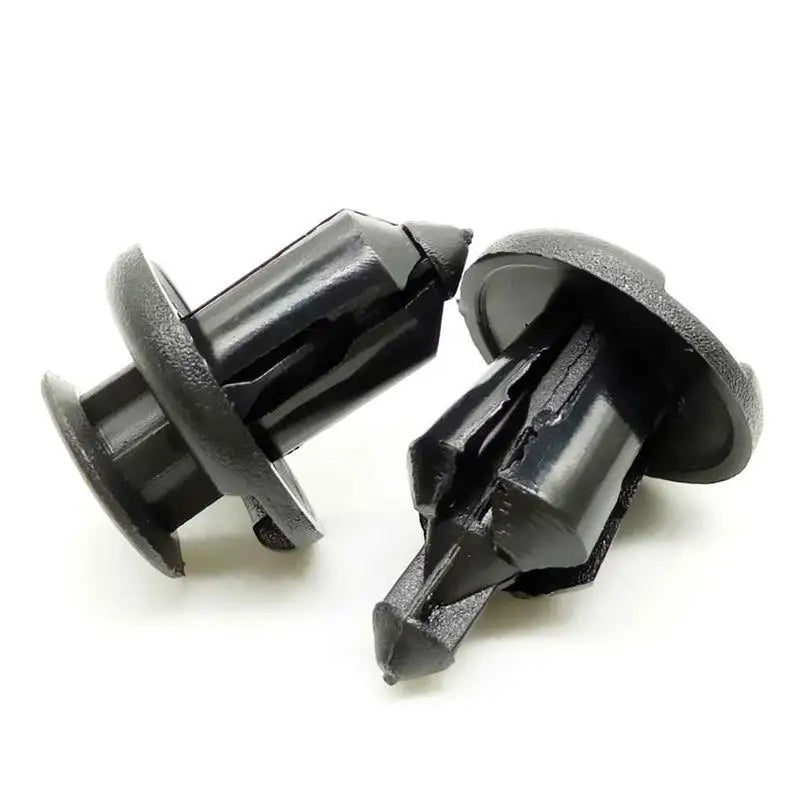 a pair of black plastic screws