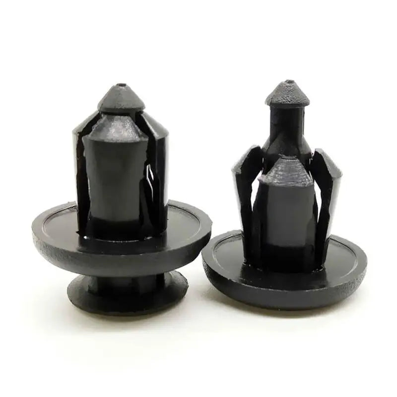 a pair of black plastic knobs