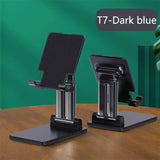 a pair of black and silver tablet stands on a table