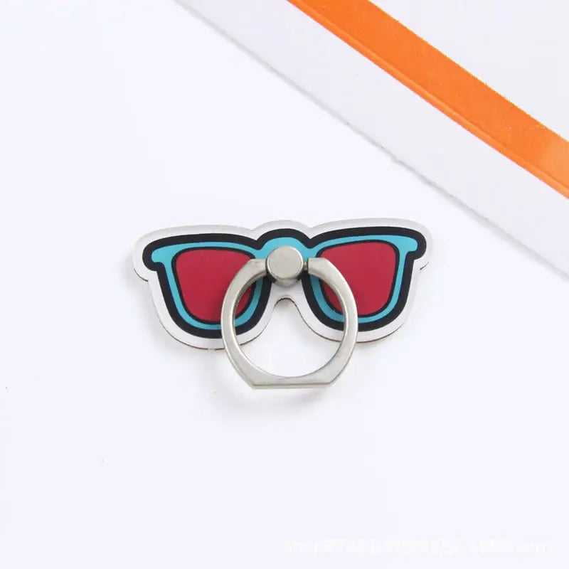 a pair of red and blue glasses with a ring