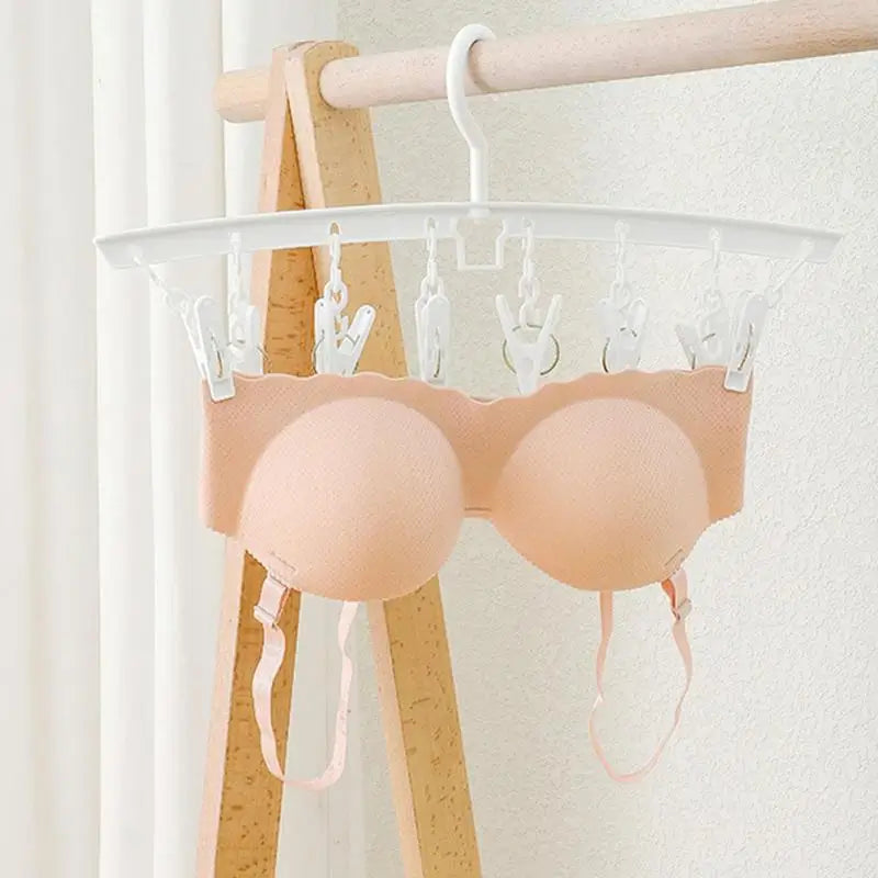 a pair of bra bras hanging on a clothes rack