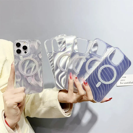 someone holding a pair of clear cases with a blue design