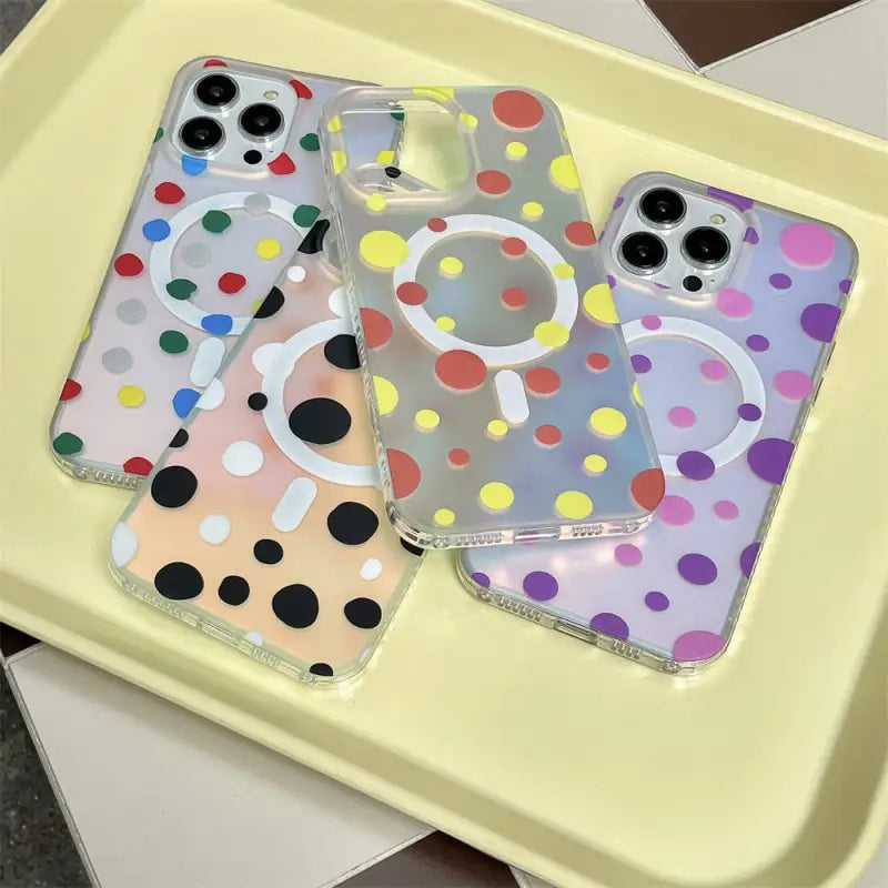 a pair of colorful polka dots phone cases