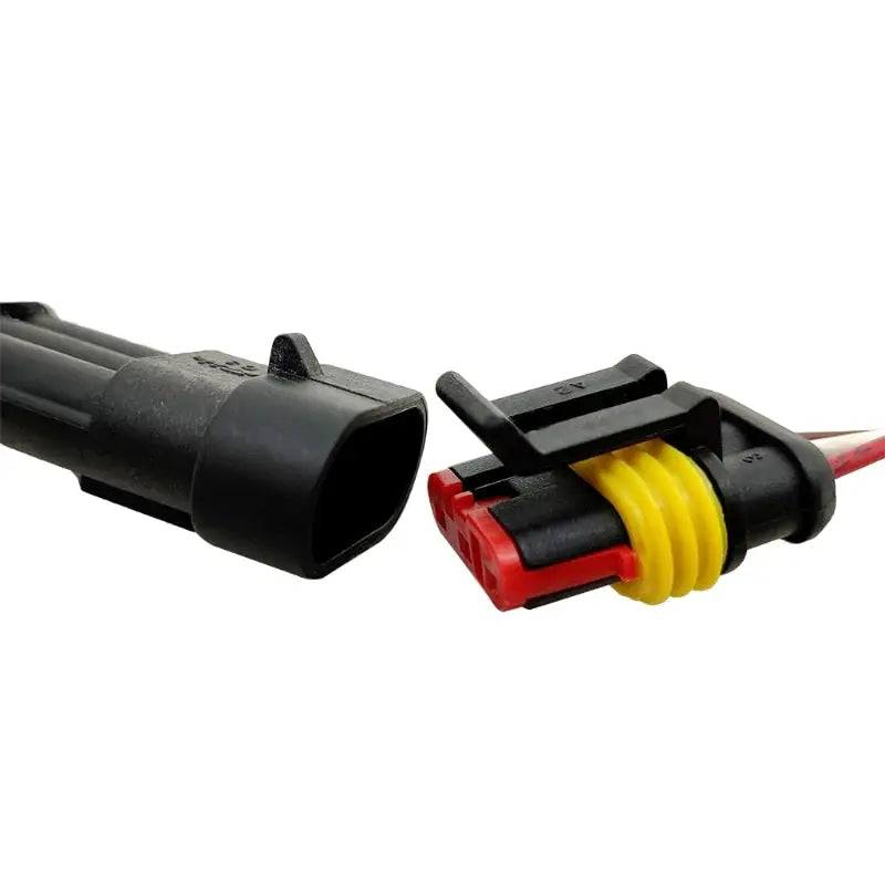 a pair of black and yellow wire connectors