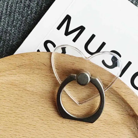 a pair of earrings on a wooden board