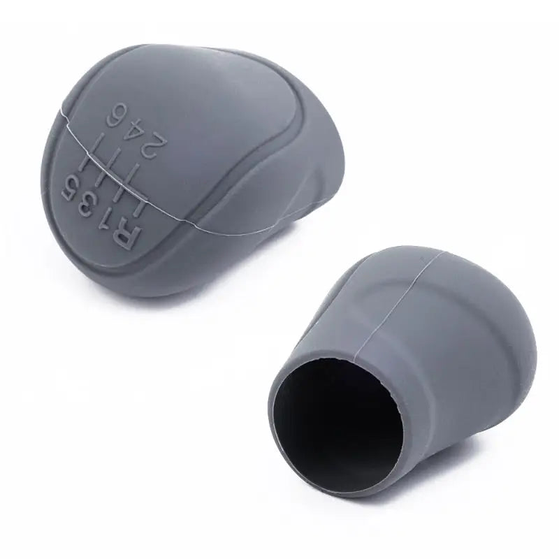 a pair of grey plastic ear plugs