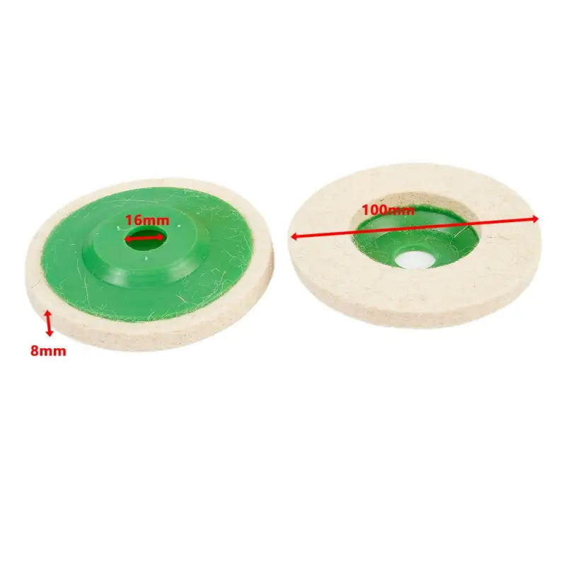 a pair of green and white grinding wheels