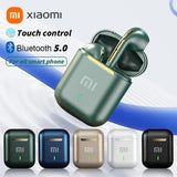 Pair of green wireless earbuds in a charging case with the Xiaomi logo.
