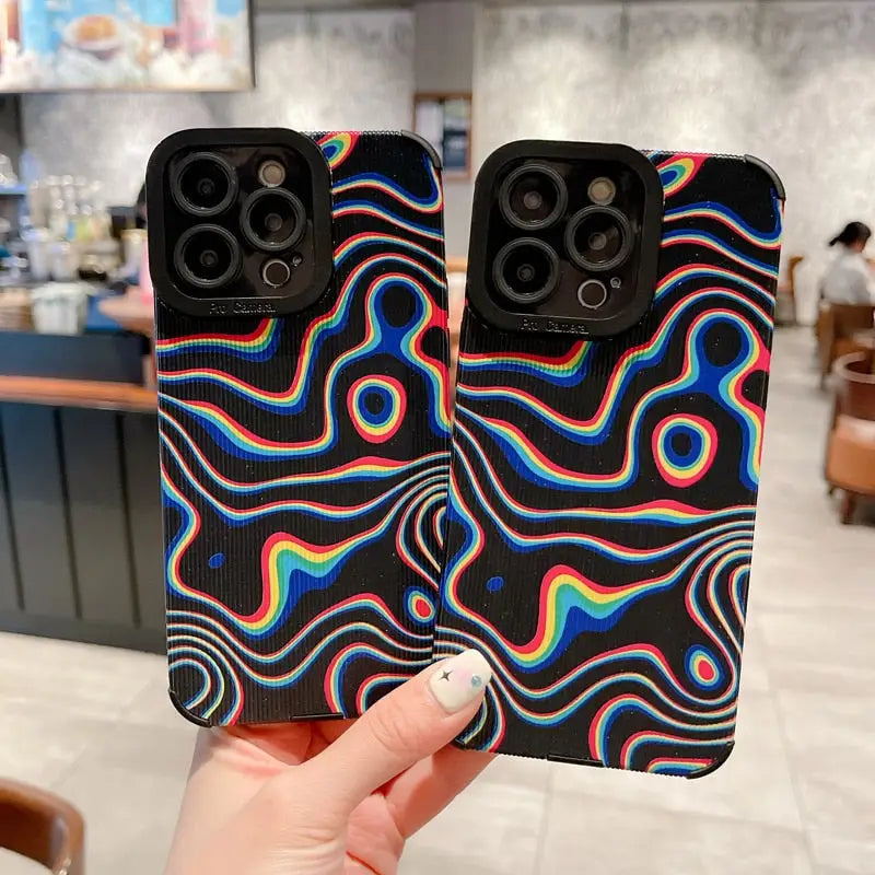 a pair of iphone cases with a colorful pattern
