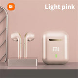 Pair of light pink wireless earbuds with their charging case.