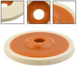 a white and orange polishing wheel with a hole