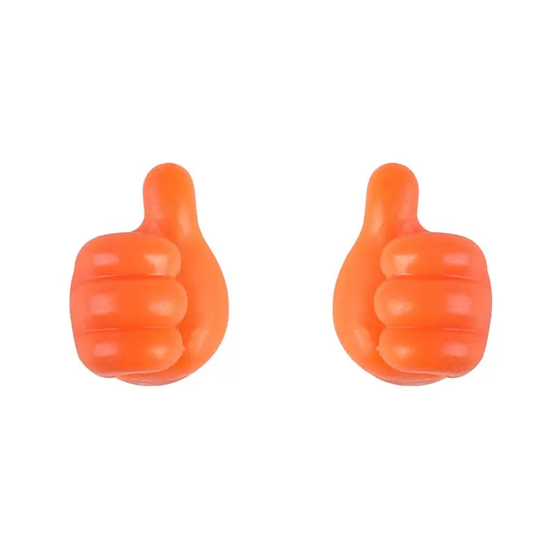 a pair of orange rubber thumbs