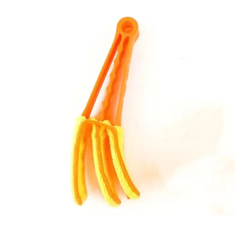 a pair of orange plastic scissors on a white background