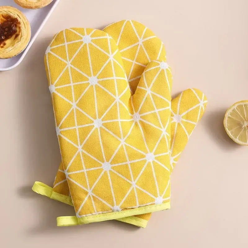 a pair of oven mits with a lemon slice