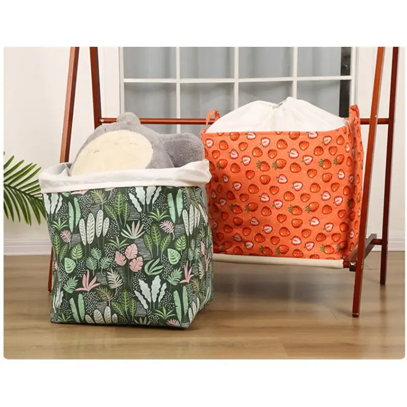 a white and orange blanket with a green plant print