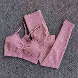 a pair of pink leggings on a grey background