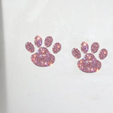 a pair of pink and white rhine paw earrings