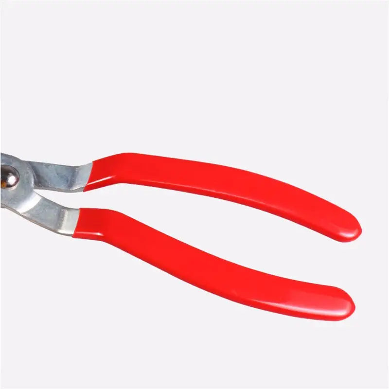 a pair of red pliers on a white background
