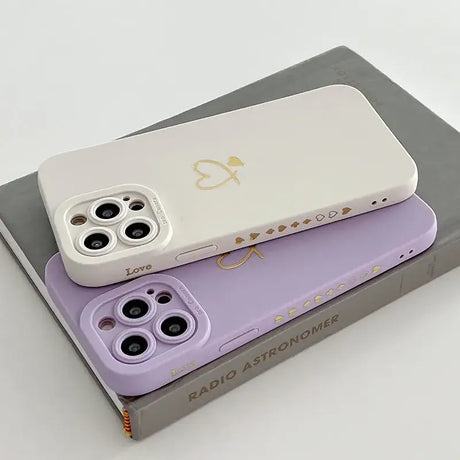 A pair of purple and white cases for the iphone