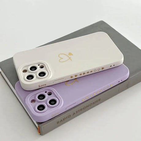 A pair of purple and white cases for the iphone