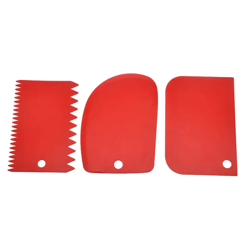 a pair of red plastic cutting blades