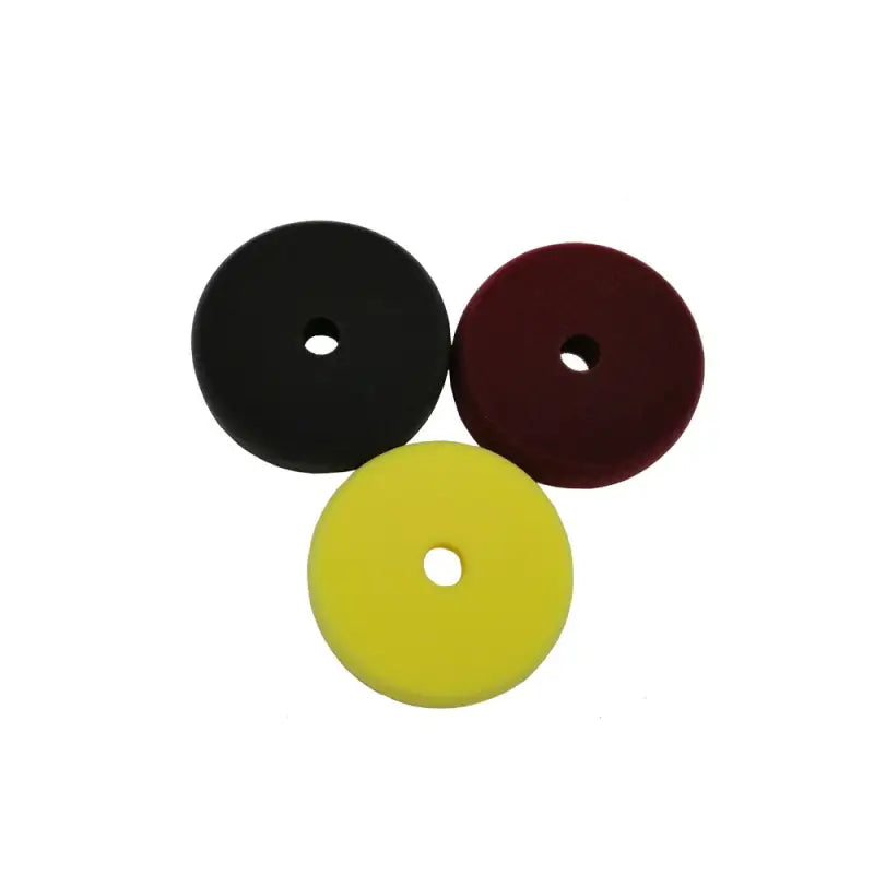 a set of three different colored plastic washers