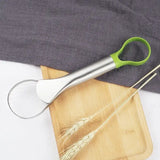 there is a pair of scissors and a pair of wheat stalks on a cutting board