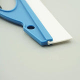 a pair of scissors on a white surface