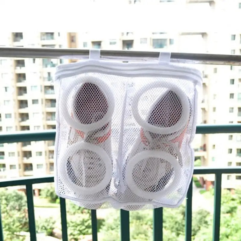 a pair of shoes hanging on a balcony