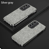 a pair of silver glitter cases on a black surface